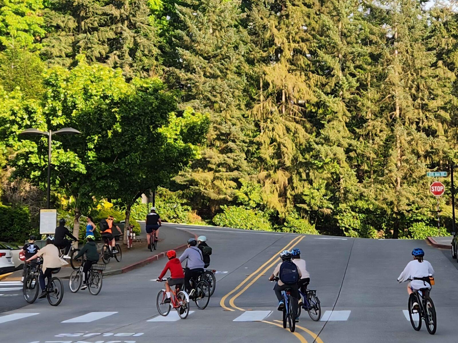 Scouts riding bikes together down a Kirkland street